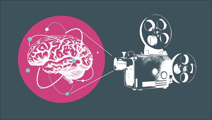 Alter Filmprojektor zeigt rotes Logo mit einem Gehirn darauf
