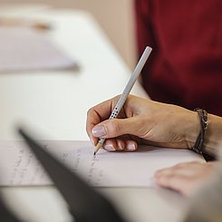 Hand mit Stift